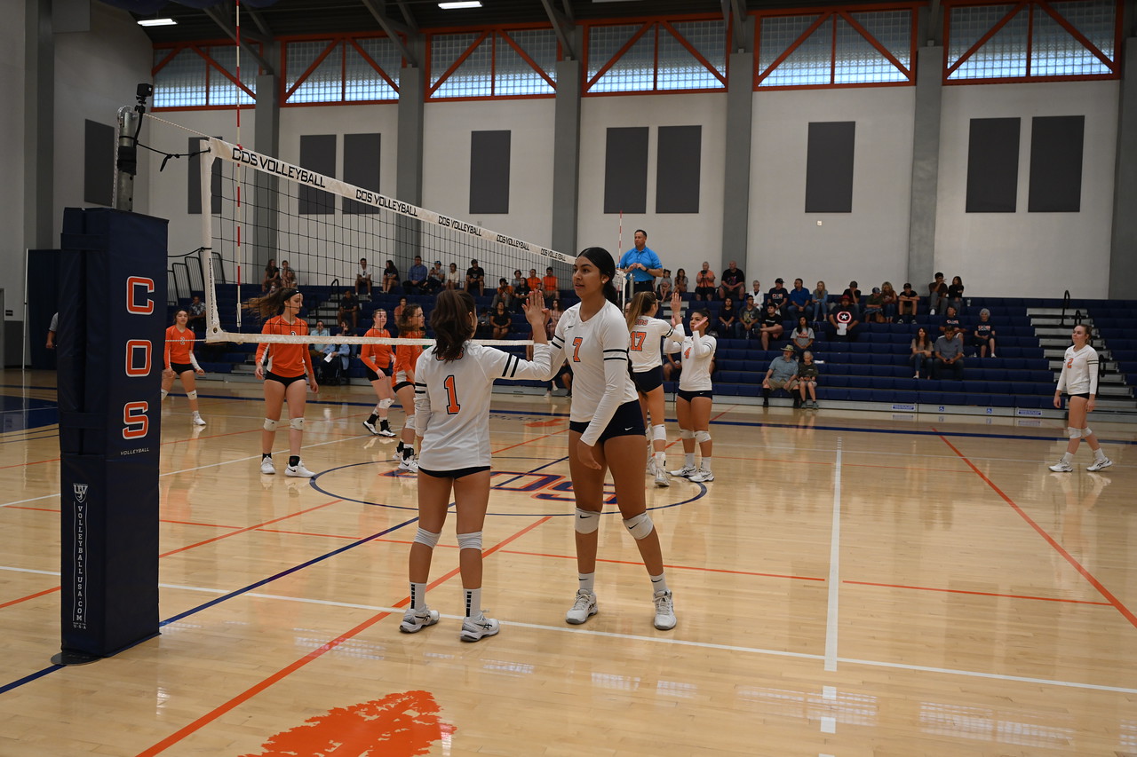 Ashley Barrera checks in for Daniela Gonzalez in a match against Reedley (Photo by Norma Foster/COS Athletics).