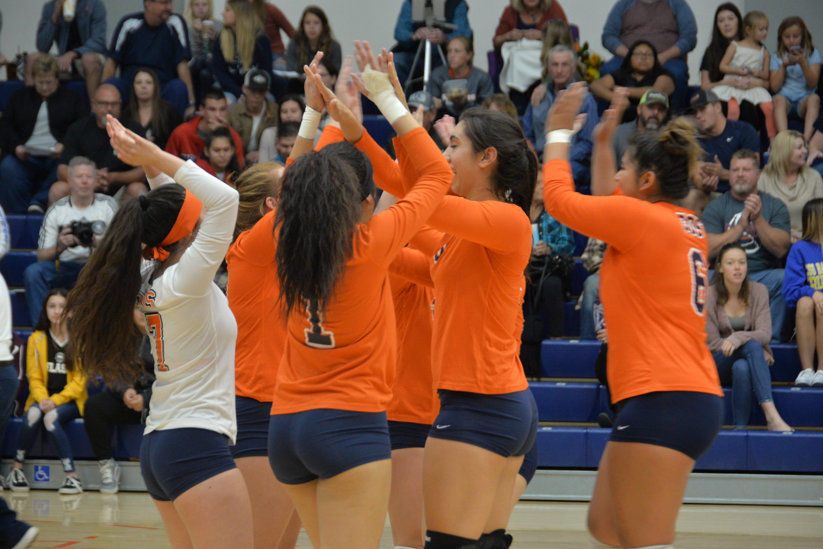 COS Volleyball clapping hands in a match earlier this year.